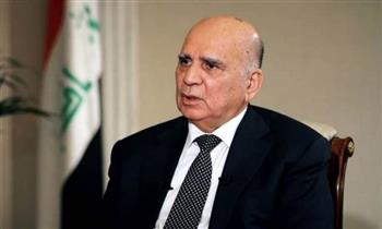 وزير الخارجية العراقي والرئيس الفرنسي يبحثان التطورات الإقليمية والدولية