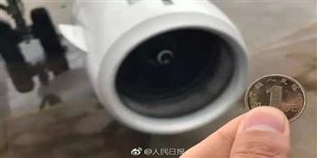 اعتقال مسافر صيني لإلقائه عملات معدنية داخل محرك الطائرة لجلب الحظ