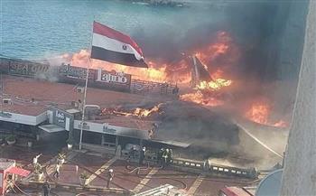 عمار يا دماغي.. رد فعل غريب لشابين أثناء حريق مطعم شهير بالإسكندرية (صورة)