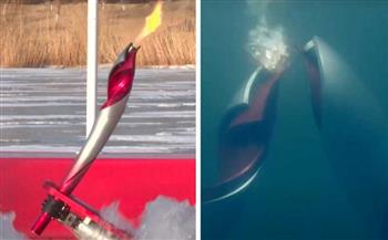 لأول مرة في التاريخ.. «روبوتان» يمرران الشعلة الأولمبية تحت الماء (فيديو)