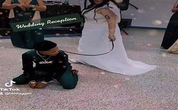 عروس تجر زوجها بـ"حزام رقبة" في الزفة بـ فيديو أثار انتقادا واسعًا