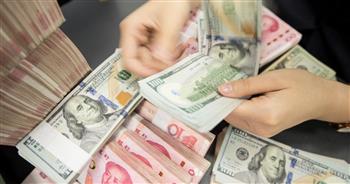 الصين تحدد سعر الدولار أمام اليوان عند 6.6960