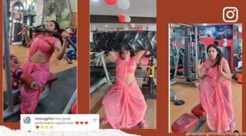 بالساري الهندي.. سيدة تمارس تمارين رياضية في صالة جيم (فيديو)