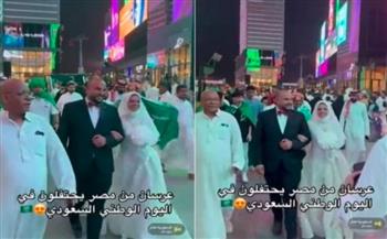 فيديو.. عروسان مصريان يشعلان احتفالات اليوم الوطني السعودي بزفافهما