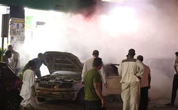  السيطرة علي حريق تاكسي أمام جامعة القاهرة 