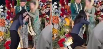حاولت تقبيل زوجها.. عروس تؤّدب ضرّتها في حفل زفافها (فيديو)