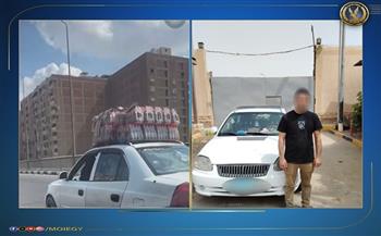 ضبط سائق أجرة سمح لشخص بالجلوس على الجزء الأمامي للسيارة في الجيزة