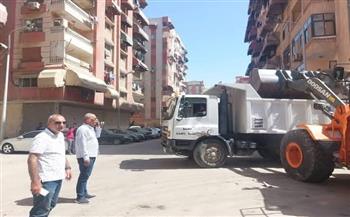  استمرار أعمال رفع الرتش والرمال بمناطق متفرقة بحي الضواحي