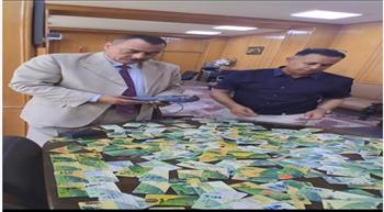 التحفظ على 126 بطاقة تموينية و60 جوال دقيق بالإسكندرية