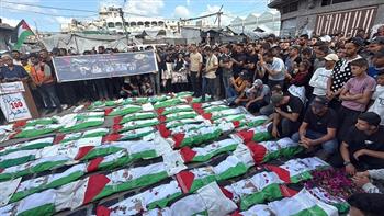 تشييع جثامين 100 شهيد فلسطيني في حي الزيتون بمدينة غزة